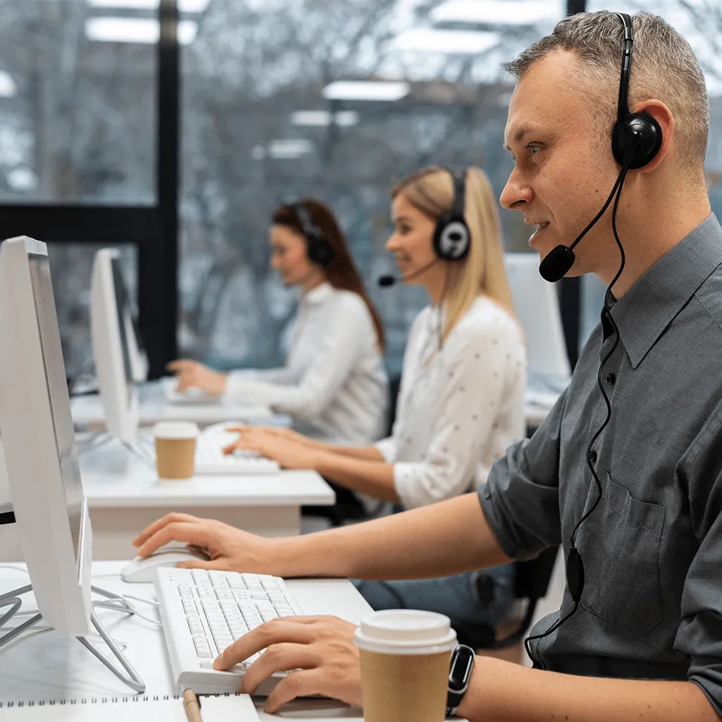 Support engineers with headsets on the helpdesk
